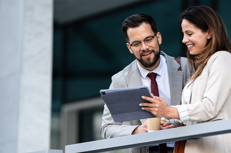 Two businesswomen working on a tablet