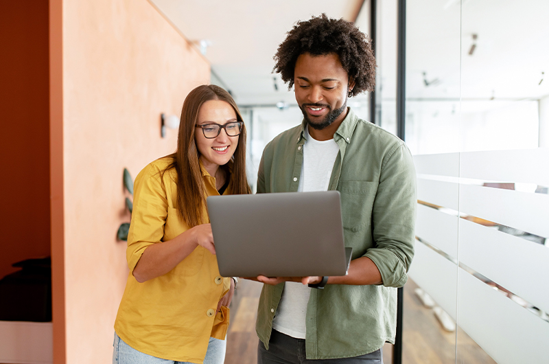 Two colleagues sharing a document