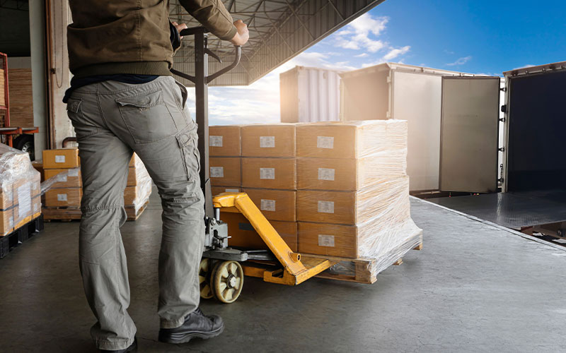 Warehouse worker using forklift