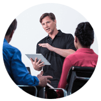 Man on tablet giving business presentation 