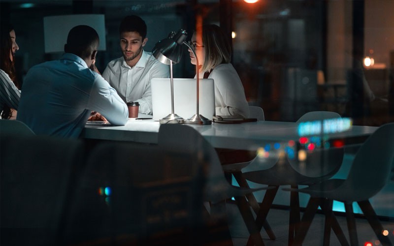 Workers working together at night