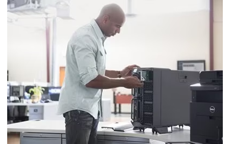 Man slotting in a server to a tower