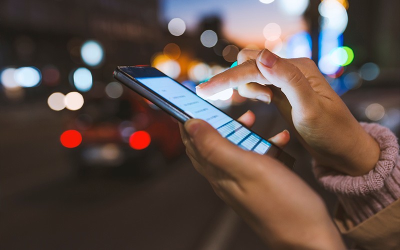 Woman holding a mobile device